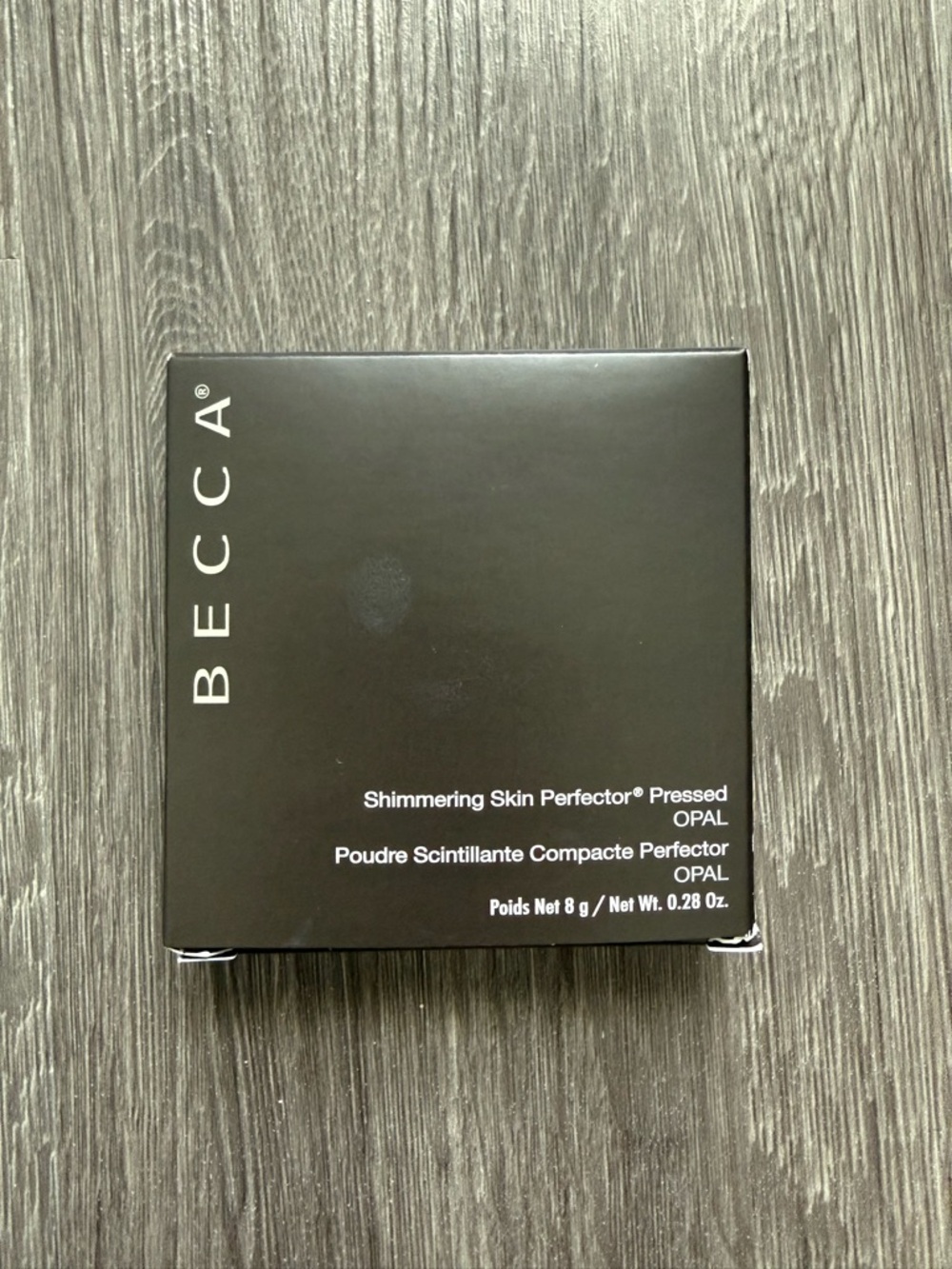 BECCA Pressed Highlighter Compact in Black Packaging